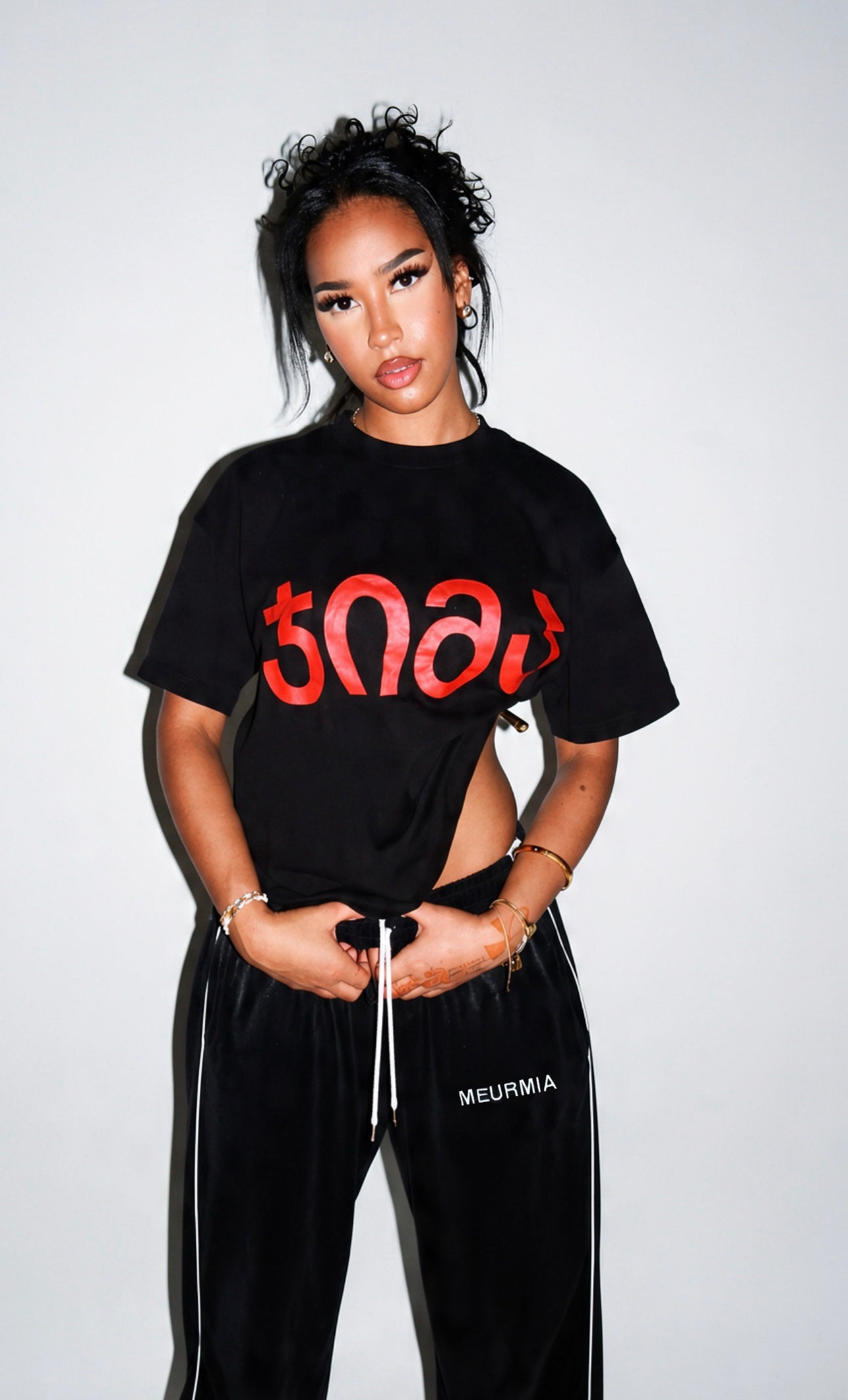 black "JIMA" t-shirt