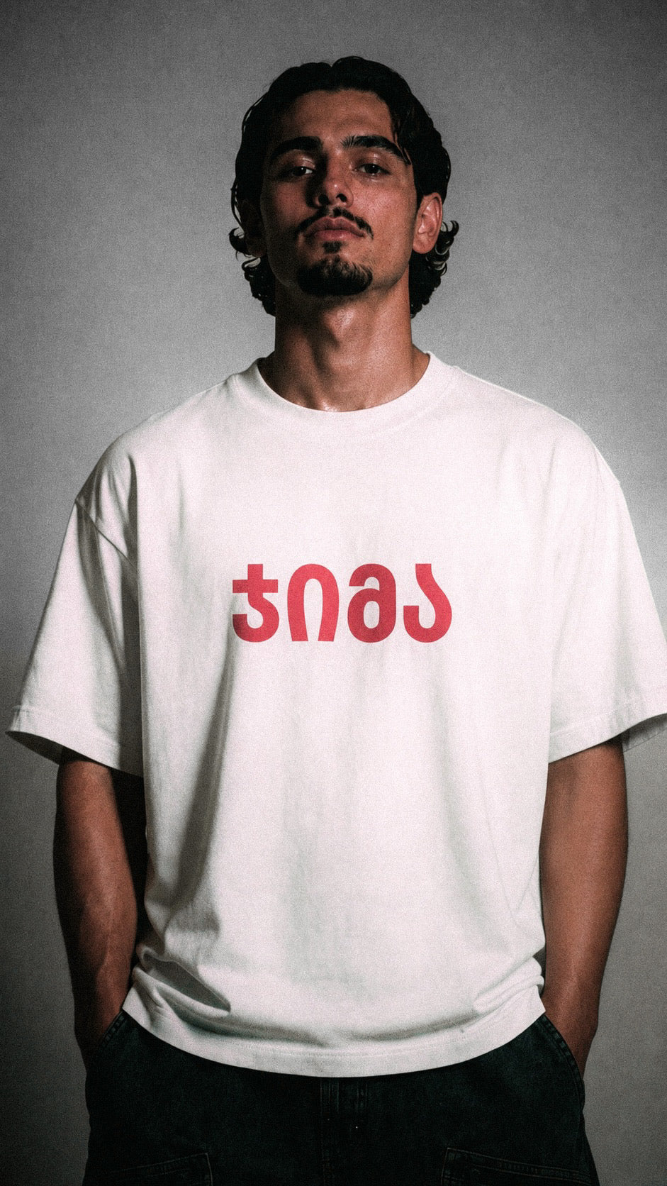 white "JIMA" t-shirt