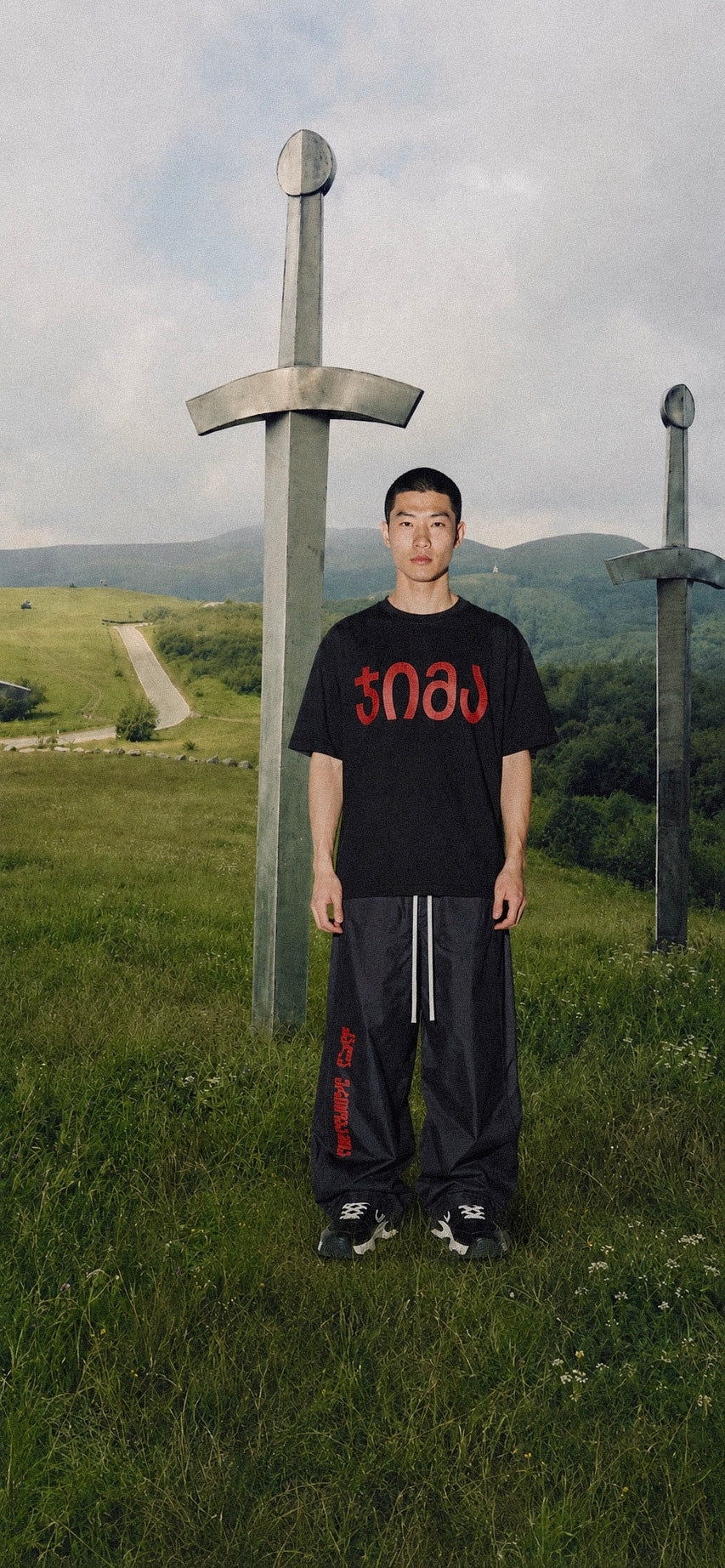 black "JIMA" t-shirt