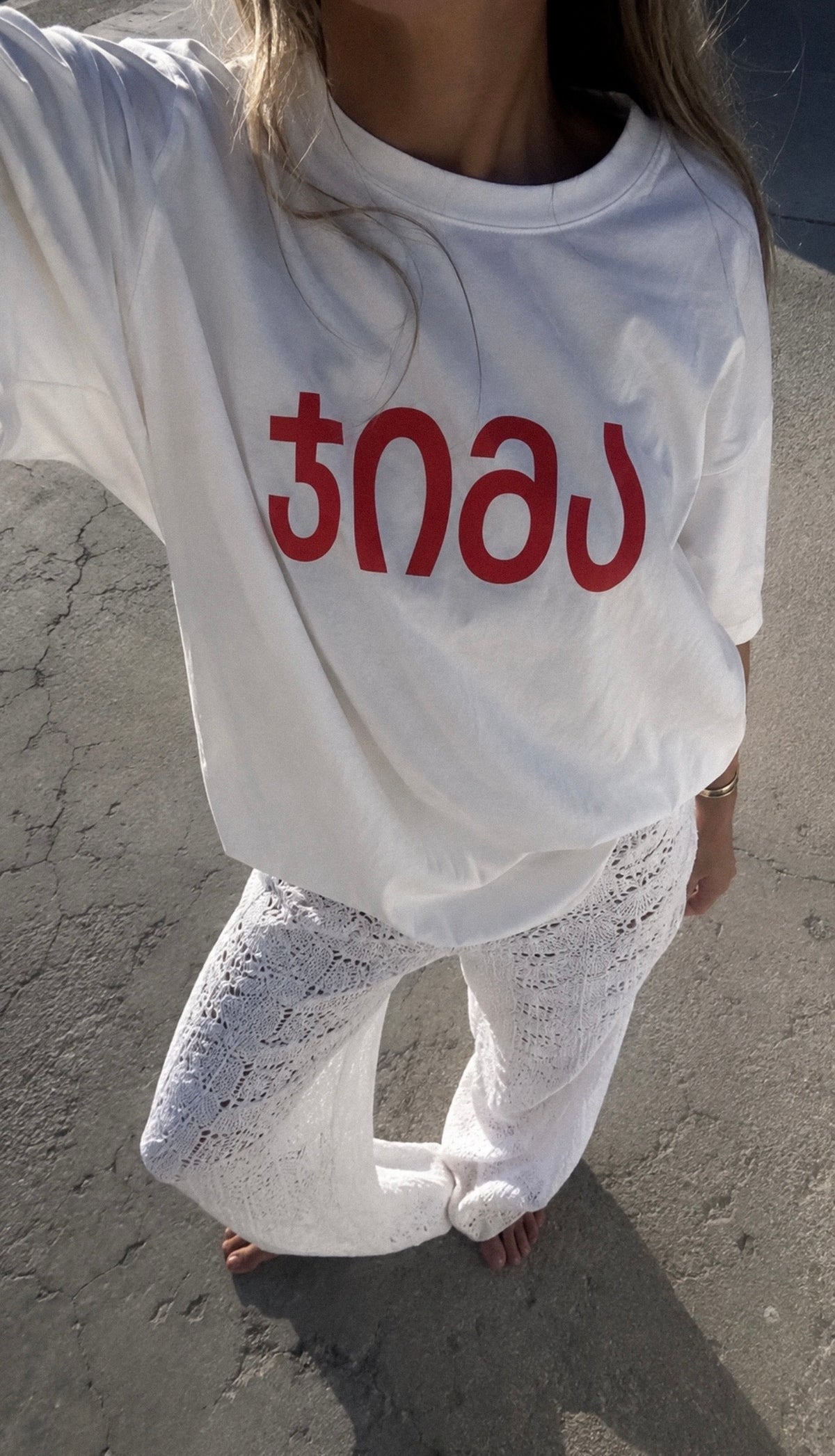 white "JIMA" t-shirt